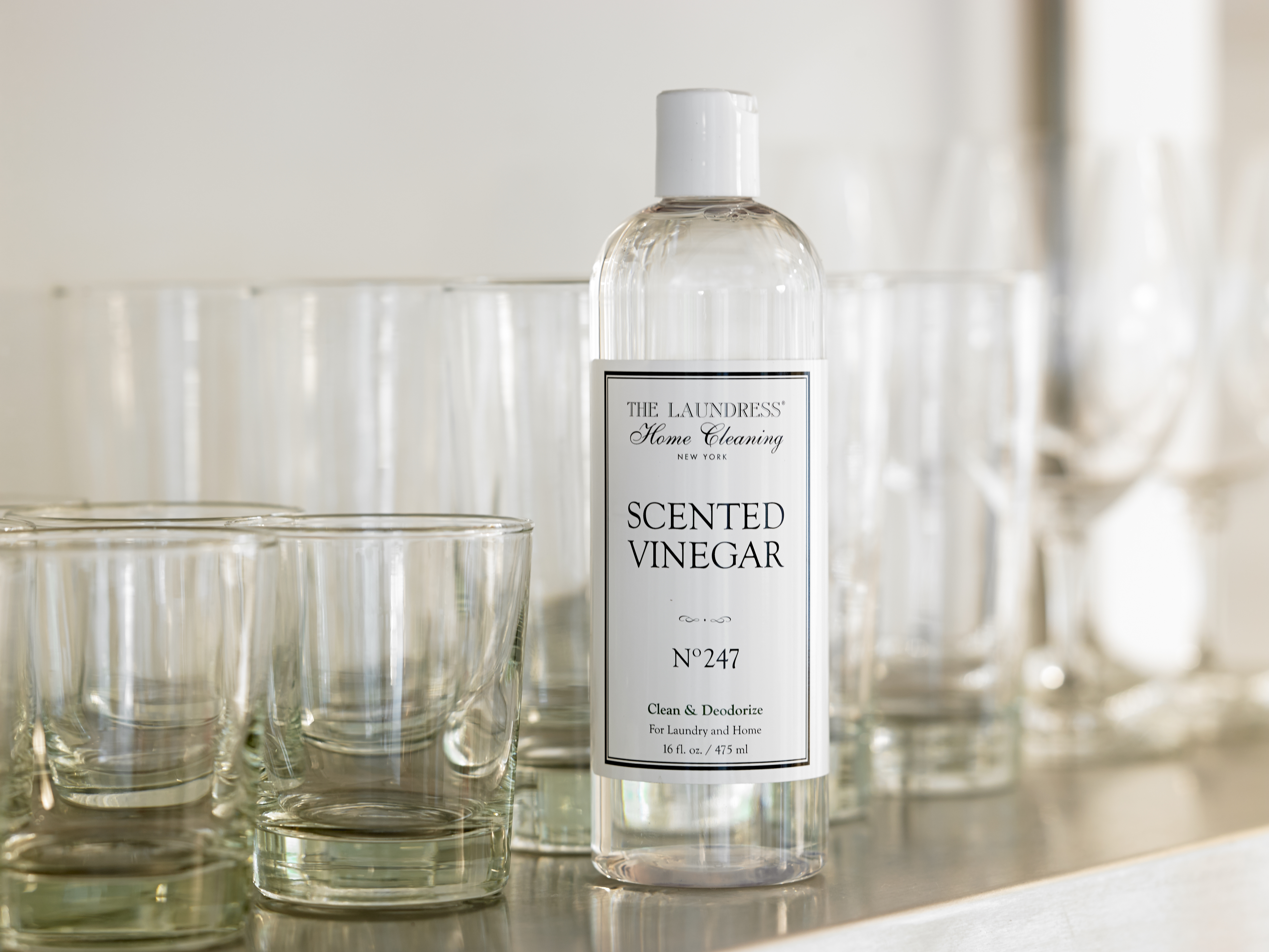 scented vinegar in front of glass cups