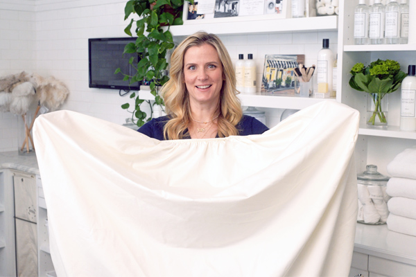 Woman folding sheets